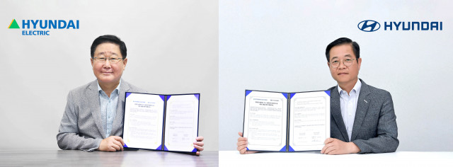 (왼쪽부터)조석 현대일렉트릭 대표이사와 김세훈 현대자동차 연료전지 사업부 부사장이 체결식에서 기념 촬영을 하고 있다. (사진=현대자동차 제공)