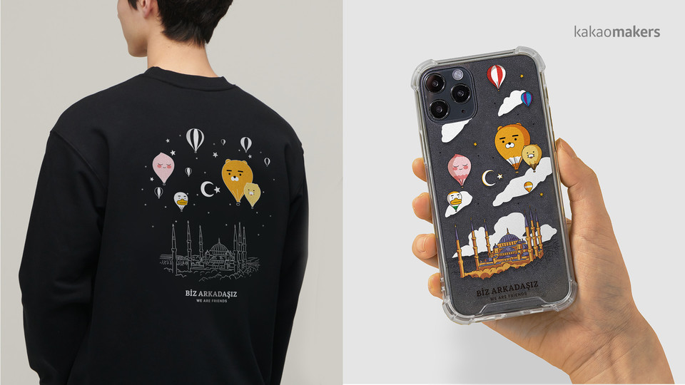 (왼쪽부터)응원 일러스트와 메시지 담은 스웨트셔츠, 스마트폰 케이스. (사진=카카오 제공)